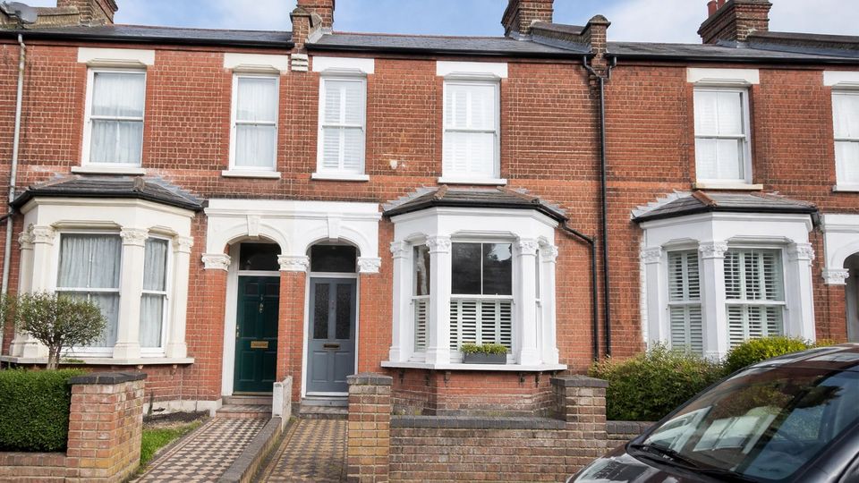 A red-brick Victorian terrace with bay windows and sash glazing, the kind of older, altered home a Level 3 survey suits